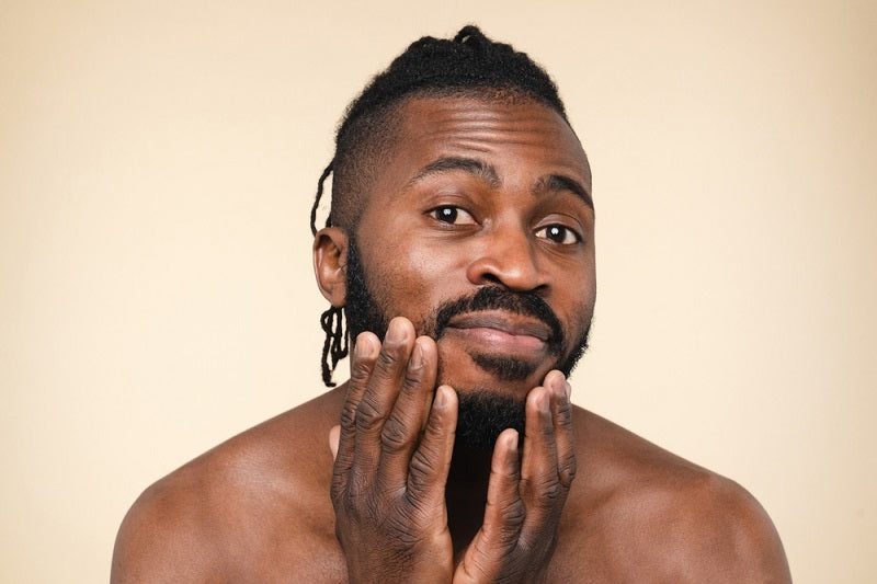 Young african-american preparing to shave