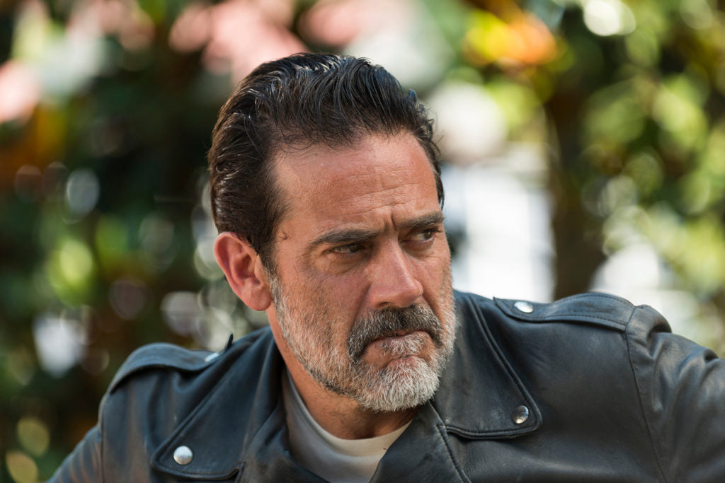 Bearded man in leather jacket looking sideways