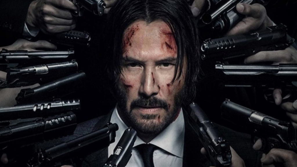 Man with beard surrounded with guns