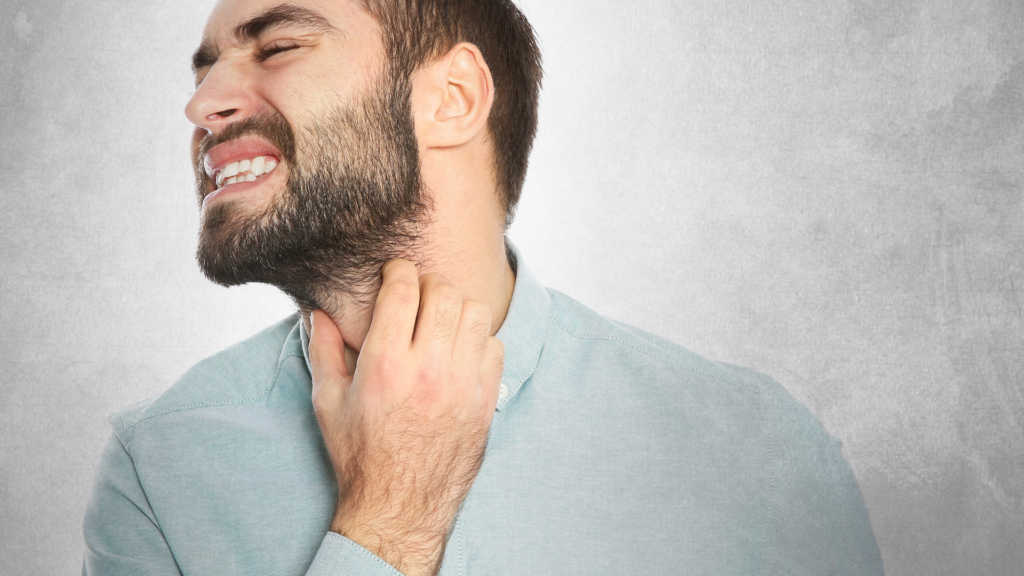 Man scratching his beard