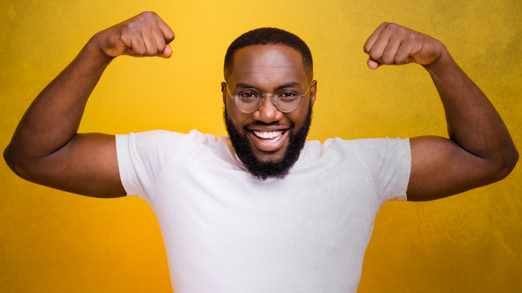 Bearded man in white shirt showing muscles